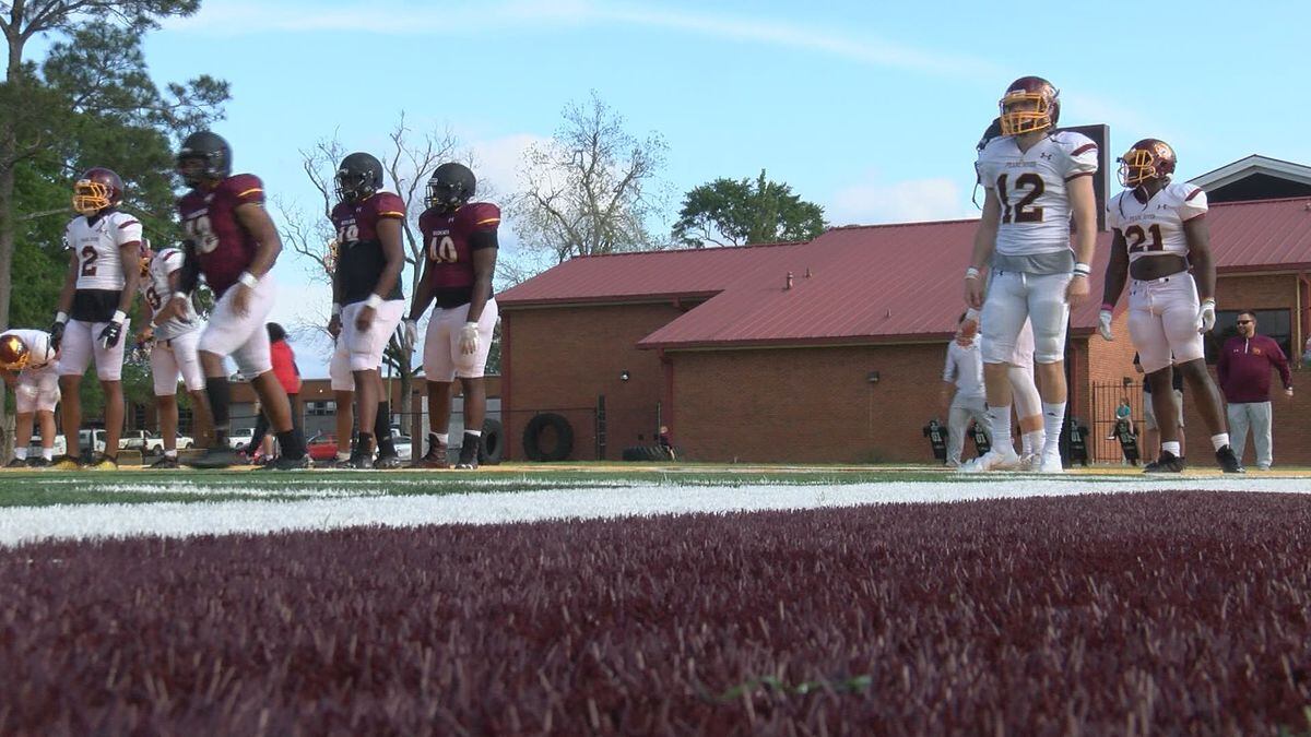 Pearl River's football team stretches before its spring game.