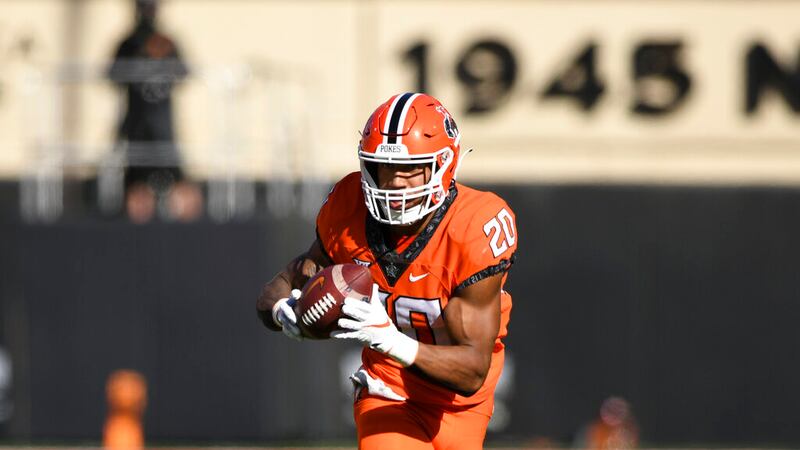 Oklahoma State running back Dominic Richardson (20) runs the ball during an NCAA college...
