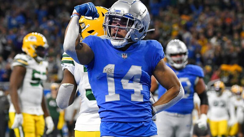Detroit Lions wide receiver Amon-Ra St. Brown reacts after a 2-yard reception for a touchdown...