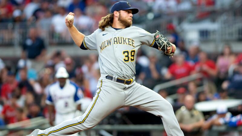 Milwaukee Brewers starting pitcher Corbin Burnes throws during the first inning of a baseball...