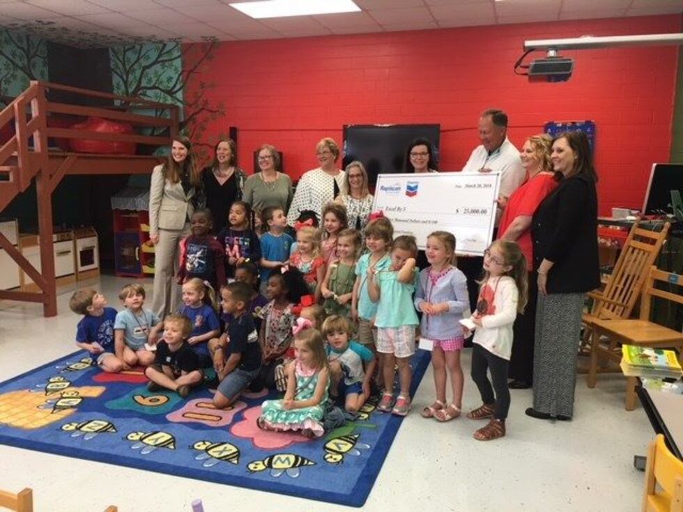 The Rapiscan Systems Classic and Chevron donated $25,000 to the Excel By 5 initiative (Photo...