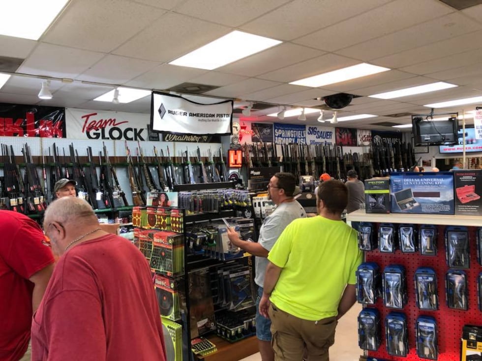 Gun shops, sporting good stores and pawn shops are packed during the Mississippi second...