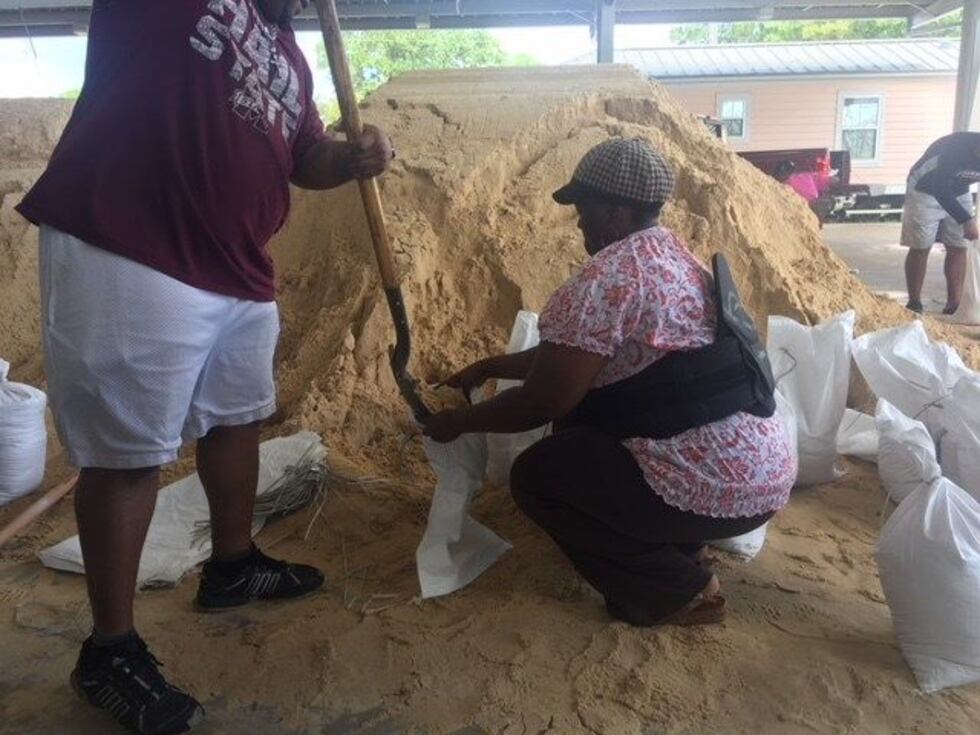 Residents fill sandbags at the fairgrounds in Pascagoula ahead of Gordon (photo source: WLOX)