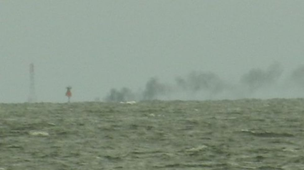 Three people were injured Friday after their boat exploded and caught fire between Petit Bois...