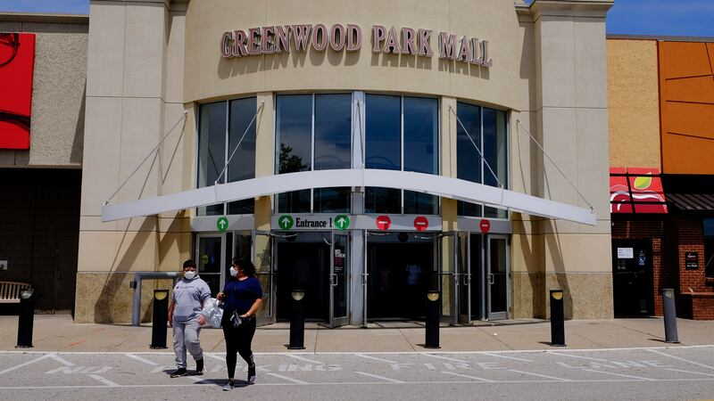 FILE - Shoppers leave the Greenwood Park Mall on May 4, 2020, in Greenwood, Ind. Indianapolis...