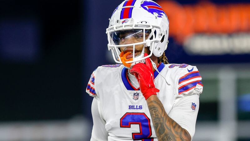 FILE - Buffalo Bills safety Damar Hamlin (3) adjusts his chin strap during the second half of...